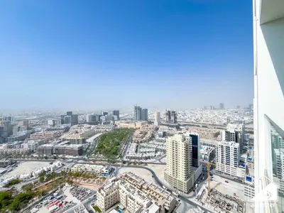 an aerial view of a city with tall buildings at Dubai JVC 1BR l Stylish Stay with Top Amenities in Dubai
