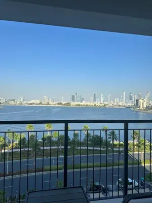 a view of the hudson river from a balcony at 2BR Apartment with full sea view & Burj Khalifa in Dubai