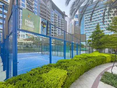 a tennis court in the middle of a city at Seven Palm Jumeirah Studio - Private Beach Access in Dubai