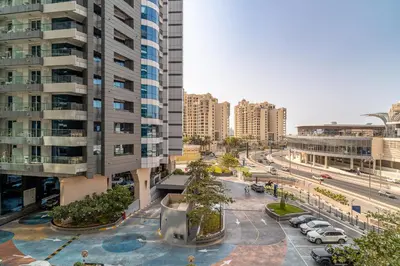 a city with tall buildings and a street with cars at Seven Palm Jumeirah Studio - Private Beach Access in Dubai