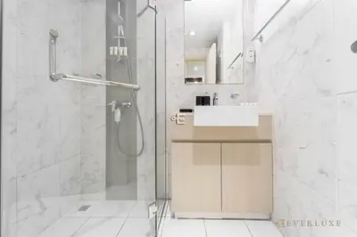 a bathroom with a shower and a sink at Cozy Studio With Style Midtown Retreat - Impz in Dubai