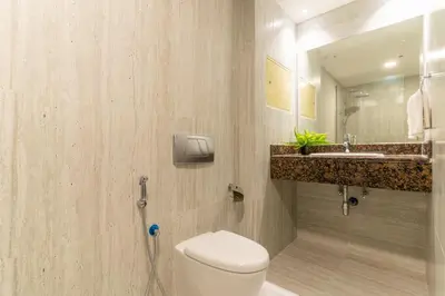 a bathroom with a toilet and a sink at The Smart Concierge - Murjan in Dubai