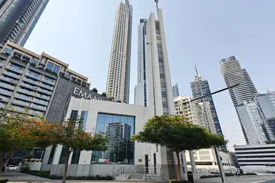 a large building in a city with tall buildings at Amal أمل Cozy City Apt 3BD with balconies, 1 min walk to Dubai Mall- Dar Samita Holiday Homes in Dubai
