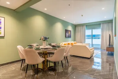 a dining room with a table and chairs at The Smart Concierge - Elite Residence in Dubai