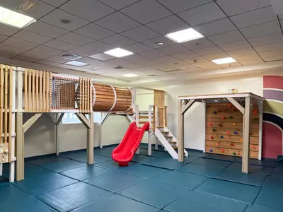 a childrens play room with a slide and a slideintend at The Smart Concierge - Elite Residence in Dubai