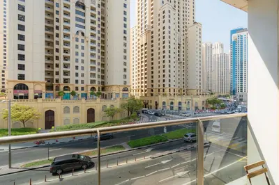 a view of a city street with tall buildings at Cozy - Accessible to Tram - Convenient in Dubai