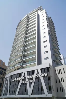 a tall building with aania sign on the side of it at GuestReady - City Nest | Balcony | Majestine Tower in Dubai