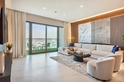 a living room with a couch and a table at STAY BY LATINEM Luxury 2BR Holiday Home CVG 807 Near Downtown in Dubai