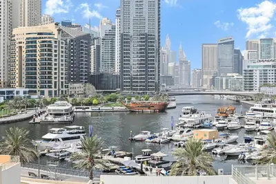 a view of a harbor with boats in a city at Chic Marina View - Timeless Studio Escape in Dubai