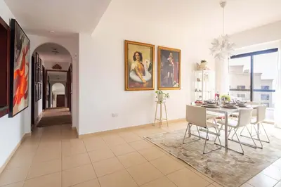a dining room with a table and chairs at Frank Porter - Rimal 1, JBR in Dubai