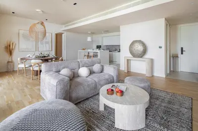 a living room with a couch and a table at Frank Porter - Bluewaters Residences 5 in Dubai