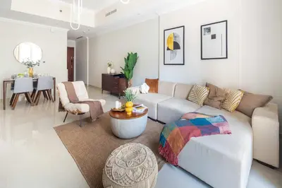 a living room with a couch and a table at Frank Porter - Dunya Tower, Downtown in Dubai