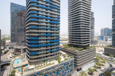 an aerial view of two tall buildings in a city at Frank Porter - Dunya Tower, Downtown in Dubai