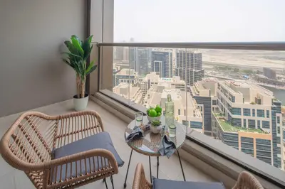a balcony with a table and chairs and a large window at Frank Porter - Dt1 Tower, Downtown Dubai in Dubai