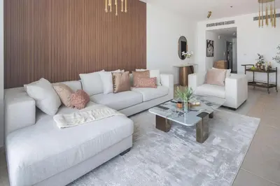 a living room with a couch and a coffee table at Frank Porter - Elite Residence, Dubai Marina in Dubai