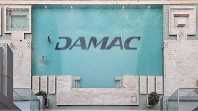 a large sign on the side of a building at DAMAC Majestine Studio with Pool, Spa and Gym Near Bus & DubaiMall in Dubai