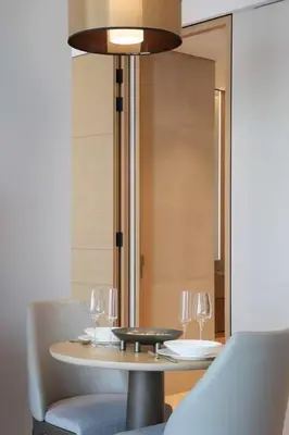 a table with chairs and wine glasses on it at Scenic 1BR - The Address JBR in Dubai