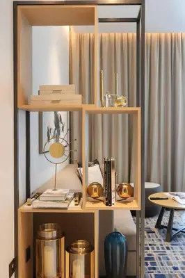 a book shelf with items on it in a room at Scenic 1BR - The Address JBR in Dubai