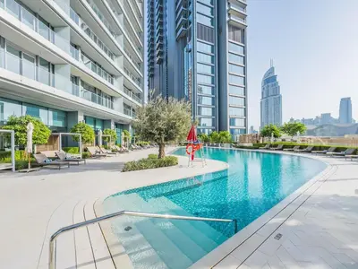 a swimming pool in the middle of a building at 1BR at Vida -Steps from Dubai Mall & Burj Khalifa in Dubai