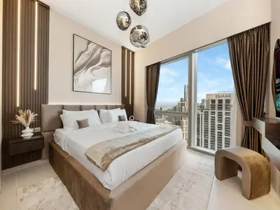 a bedroom with a large bed and a large window at Skyline View - 2 Balconies - Pool plus Gym - Sleeps 8 in Dubai