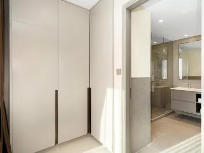 a bathroom with white walls and a sink and a mirror at Skyline View - 2 Balconies - Pool plus Gym - Sleeps 8 in Dubai