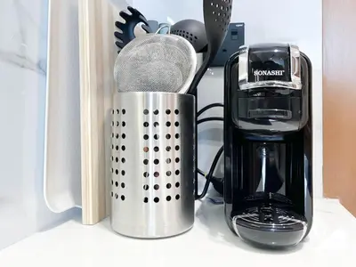 a counter top with a coffee maker and a blender at JVC Retreat with Pool & Balcony in Dubai