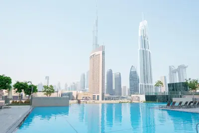 a view of a city skyline with tall buildings at 54th Floor Burj Khalifa&Mall Access Infinity Pool in Dubai