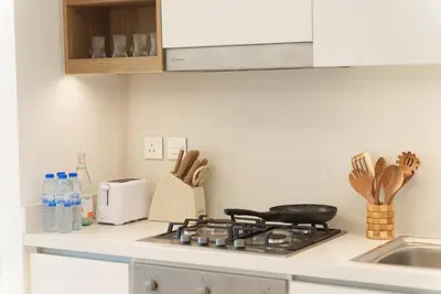 a kitchen counter with a stove top in a kitchen at 54th Floor Burj Khalifa&Mall Access Infinity Pool in Dubai