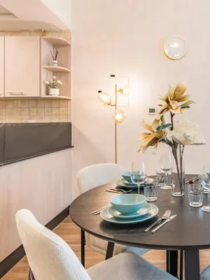 a dining room with a table and chairs at Spacious 1BR-Walk to Dubai Mall & Khalifa-Downtown Dubai in Dubai