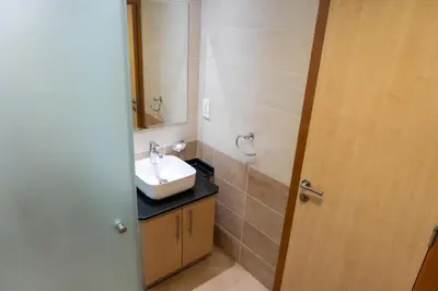 a bathroom with a sink and a mirror at Luxury 2 BHK in Ocean Heights at Dubai Marina Living with Stunning Views in Dubai