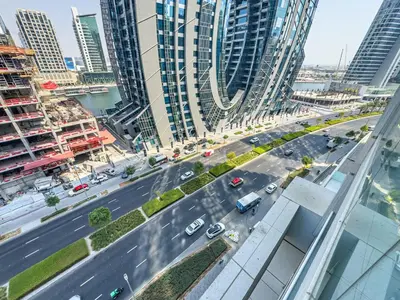 an aerial view of a busy city street with buildings at Stylish 2 BR Business Bay - Canal View - Gym and Pool in Dubai