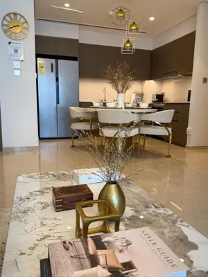 a kitchen and dining room with a table and chairs at Burj Khalifa and Dubai Fountian Direct View - Luxury 2BR Flat - Downtown Dubai in Dubai