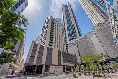 a building in a city with tall buildings at Dunya Tower 1BR Heart of Dubai Downtown in Dubai