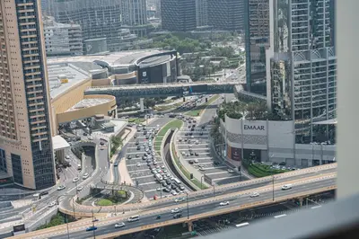 a busy highway in a city with cars on it at Burj View Chic 2BR Downtown Dubai in Dubai