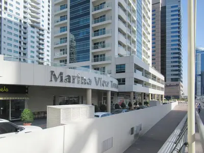 a white building with a sign that reads marina view inn at Stylish 1BR - Pool, Gym Access & City Skyline Views near JBR Beach in Dubai