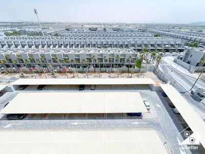 an overhead view of a building with a parking lot at Luxury Studio in MAG City l Private Balcony in Dubai