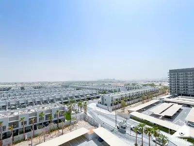an aerial view of a city with buildings and palm trees at Modern Studio Retreat l MAG l Parking & WI-FI in Dubai