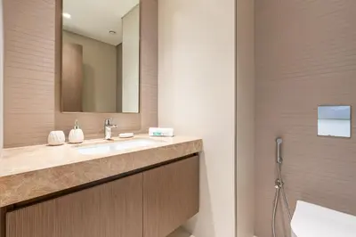 a bathroom with a sink and a mirror at Luxe 2 bedroom Apartment full Sea and Palm Views in Dubai