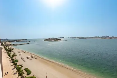 a view of a beach and the ocean at Luxe 2 bedroom Apartment full Sea and Palm Views in Dubai