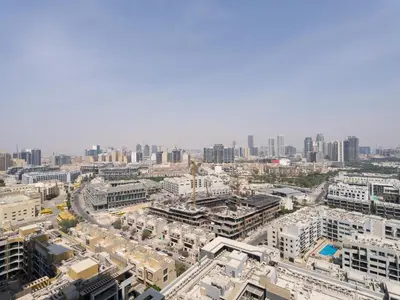 an aerial view of a city with tall buildings at Chic and Stylish 1 BDR in Binghatti corner - JVC in Dubai