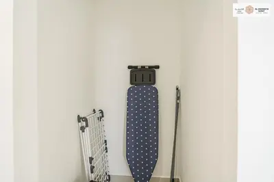 a skateboard is hanging on a wall at Serenity 1 bdr with private garden in Dubai