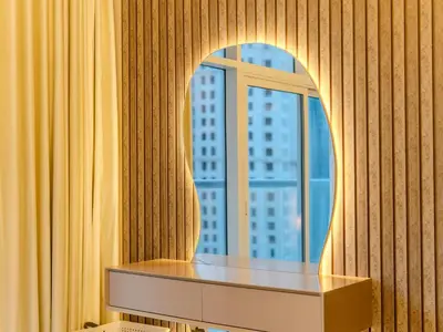 a dressing table in front of a window at Superb 2BR Prime Locale between Dubai Marina JBR in Dubai