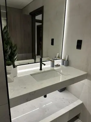 a bathroom with a sink and a large mirror at LUXE - Luxury Studio - Modern and Cozy in Dubai