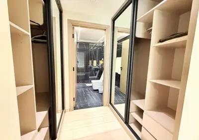 a bathroom with a mirror and a toilet in a room at Binghatti Crescent Cozy 2 BR in Dubai
