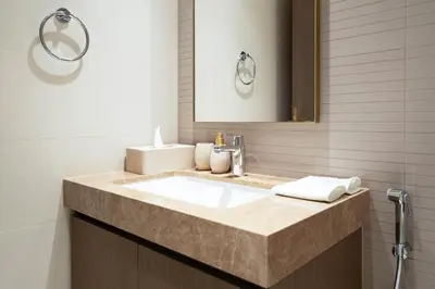 a bathroom with a sink and a mirror at KeyRock - Palm & Sea View Retreat with Pool Access in Dubai
