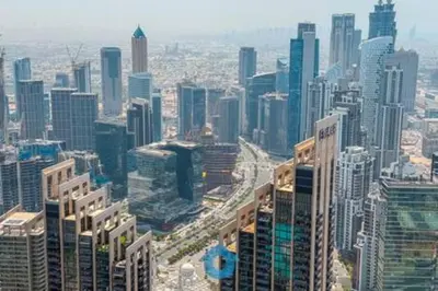 an aerial view of a large city with tall buildings at Next to Burj Khalifa & Dubai Mall - Luxury 2BR with Dubai Skyline Views - Like Home in Dubai