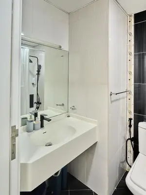 a white bathroom with a sink and a toilet at Best location in Marina & jbr and marina view 1 minute from JBR in Dubai