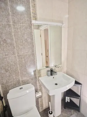 a bathroom with a white toilet and a sink at Best location in Marina & jbr and marina view 1 minute from JBR in Dubai