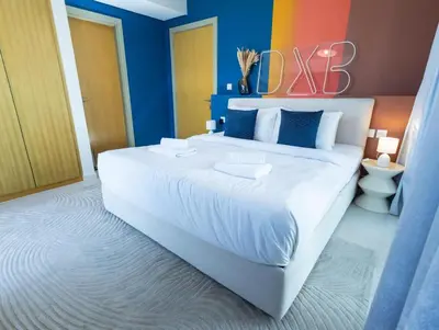 a bedroom with a large bed with a sign on it at Palm Mirage Holiday Homes-2BR With Burj Alarab and City view in Dubai