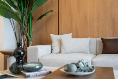 a living room with a couch and a table at Ultra Luxuary 2BR - Creek Beach - Serenity Living in Dubai
